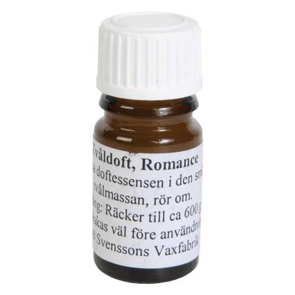 Brun glassflaske med hvit skrukork, etikett med "Såpeduft Romance" og bruksanvisning.