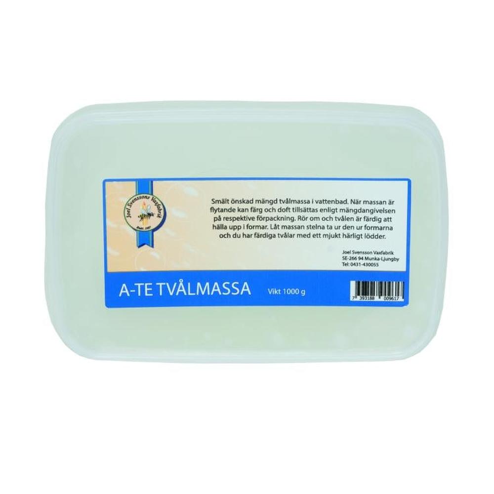 Klar såpemasse i en hvit plastbeholder, 1 kg, med blå og hvit etikett.